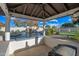 Relaxing pool area with a waterfall feature and covered seating at 2335 E Plum St, Gilbert, AZ 85298