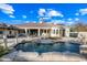 Inviting pool and patio with lounge chairs and fountains at 2335 E Plum St, Gilbert, AZ 85298