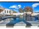 Inviting swimming pool with a tiled spa and waterfall feature at 2335 E Plum St, Gilbert, AZ 85298