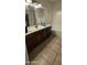 Bathroom with vanity, sink, mirror, and bathtub at 25422 W Maldonado Ct, Buckeye, AZ 85326