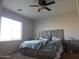 Bedroom with a queen bed and ceiling fan at 25422 W Maldonado Ct, Buckeye, AZ 85326