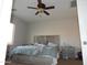 Bedroom with a queen bed and ceiling fan at 25422 W Maldonado Ct, Buckeye, AZ 85326