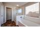 Bathroom features a bathtub, shower, and tile flooring at 41208 W Bravo Dr, Maricopa, AZ 85138