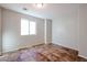 Spacious bedroom with tile floors and a window at 41208 W Bravo Dr, Maricopa, AZ 85138
