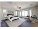 Spacious main bedroom with large windows, and plenty of natural light at 41208 W Bravo Dr, Maricopa, AZ 85138