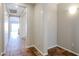 Bright hallway with tile flooring leading to other rooms at 41208 W Bravo Dr, Maricopa, AZ 85138