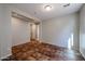 Light and airy hallway with tile floors at 41208 W Bravo Dr, Maricopa, AZ 85138