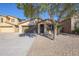 Single-story house with a two-car garage and landscaping at 41208 W Bravo Dr, Maricopa, AZ 85138