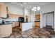 Eat-in kitchen with island, stainless steel appliances, and granite countertops at 41208 W Bravo Dr, Maricopa, AZ 85138