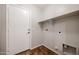 Laundry room with shelving and tile flooring at 41208 W Bravo Dr, Maricopa, AZ 85138