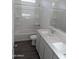 Bathroom with double vanity, bathtub, and gray tile flooring at 48486 N Duran Way, Gold Canyon, AZ 85118