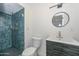 Modern bathroom with blue tile shower and floating vanity at 6312 N 13Th St, Phoenix, AZ 85014