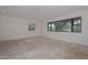Large bedroom with a view and unfinished floors at 6312 N 13Th St, Phoenix, AZ 85014