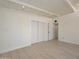 Spacious bedroom with barn doors and light wood floors at 6312 N 13Th St, Phoenix, AZ 85014