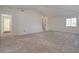 Large bedroom with high ceilings and unfinished floors at 6312 N 13Th St, Phoenix, AZ 85014