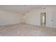 Spacious bedroom with high ceilings and unfinished floors at 6312 N 13Th St, Phoenix, AZ 85014