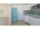 Charming kitchen corner with teal tile and a retro turquoise fridge at 6312 N 13Th St, Phoenix, AZ 85014