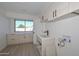 Bright laundry room featuring modern cabinetry and a clean design at 6312 N 13Th St, Phoenix, AZ 85014