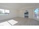 Light-filled living room with wood-look floors and kitchen access at 6312 N 13Th St, Phoenix, AZ 85014