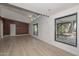 Open living area with large windows and wood-look flooring at 6312 N 13Th St, Phoenix, AZ 85014