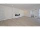 Spacious living room with a modern fireplace and light wood floors at 6312 N 13Th St, Phoenix, AZ 85014