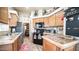 Modern kitchen with black appliances and granite countertops at 72 Jacknife Dr, Apache Junction, AZ 85119