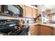 Kitchen features a black electric range and microwave at 72 Jacknife Dr, Apache Junction, AZ 85119