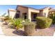 Landscaped backyard with patio and desert plants at 846 N Pueblo Dr # 113, Casa Grande, AZ 85122