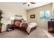 Comfortable bedroom with a double bed, nightstands, and large window at 846 N Pueblo Dr # 113, Casa Grande, AZ 85122