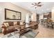 Open living room with adjacent kitchen and breakfast bar at 846 N Pueblo Dr # 113, Casa Grande, AZ 85122