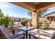 Covered patio with seating area and courtyard view at 846 N Pueblo Dr # 113, Casa Grande, AZ 85122