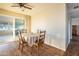 Cozy dining area with a table and chairs, near sliding glass doors at 10701 W Salem Dr, Sun City, AZ 85351