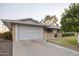 White garage door and spacious driveway offering convenient parking at 10701 W Salem Dr, Sun City, AZ 85351