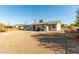 Large backyard with gravel and a small patio area at 12216 N 107Th Ave, Sun City, AZ 85351