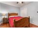 Bedroom with wood bed frame and wood floors at 12216 N 107Th Ave, Sun City, AZ 85351