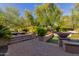 Landscaped backyard with patio and seating area at 12832 W Pinnacle Vista Dr, Peoria, AZ 85383