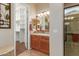 Bathroom with walk-in closet and double vanity at 12832 W Pinnacle Vista Dr, Peoria, AZ 85383