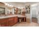 Elegant bathroom with double sinks, large mirror, and walk-in shower at 12832 W Pinnacle Vista Dr, Peoria, AZ 85383