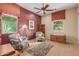 Bright bedroom with two armchairs and built-in shelving at 12832 W Pinnacle Vista Dr, Peoria, AZ 85383