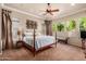 Main bedroom with large windows and ceiling fan at 12832 W Pinnacle Vista Dr, Peoria, AZ 85383