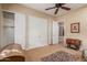 Bedroom with double door closets and a ceiling fan at 12832 W Pinnacle Vista Dr, Peoria, AZ 85383