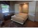 Small bedroom with a murphy bed and built-in closet at 12832 W Pinnacle Vista Dr, Peoria, AZ 85383