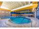 Indoor community pool with lap lanes and a spa at 12832 W Pinnacle Vista Dr, Peoria, AZ 85383