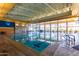 Indoor lap pool with large windows and high ceilings at 12832 W Pinnacle Vista Dr, Peoria, AZ 85383