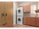 Laundry room with washer, dryer, cabinets and extra storage at 12832 W Pinnacle Vista Dr, Peoria, AZ 85383