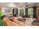 Bright living room featuring hardwood floors, ample natural light, and comfortable furniture at 12832 W Pinnacle Vista Dr, Peoria, AZ 85383