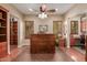 Home office with built-in bookcases and a large desk at 12832 W Pinnacle Vista Dr, Peoria, AZ 85383