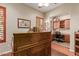 Spacious home office with wood desk and built-in shelving at 12832 W Pinnacle Vista Dr, Peoria, AZ 85383