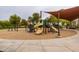 Community playground with modern equipment and shade structure at 12832 W Pinnacle Vista Dr, Peoria, AZ 85383