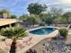 Inviting backyard oasis featuring a sparkling pool, surrounded by desert landscaping at 13108 N 76Th St, Scottsdale, AZ 85260